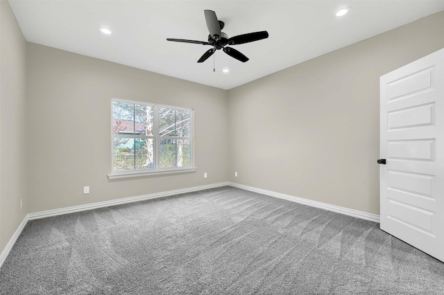 unfurnished room featuring ceiling fan and carpet flooring