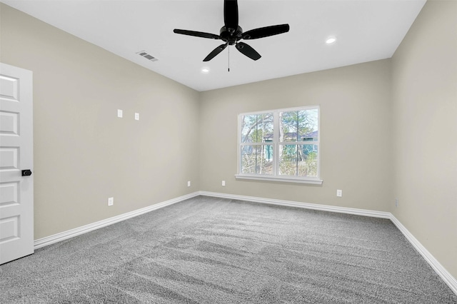 spare room featuring ceiling fan and carpet floors