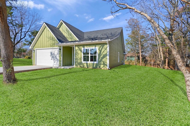 view of front of house with a garage and a front yard