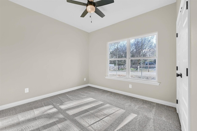 unfurnished room featuring ceiling fan and carpet flooring