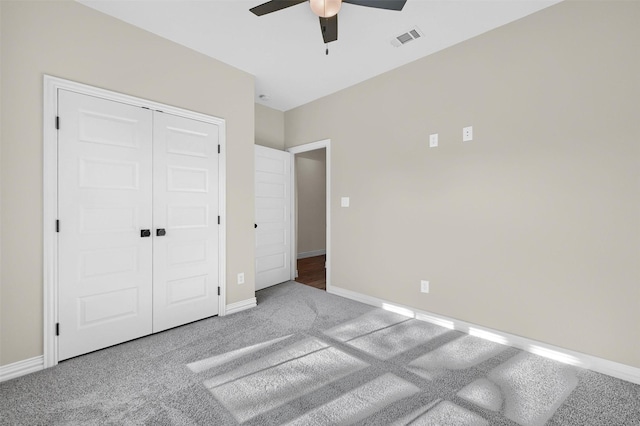 unfurnished bedroom with a closet, ceiling fan, and carpet