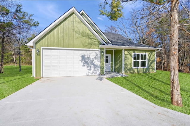 view of front of home featuring a garage and a front yard