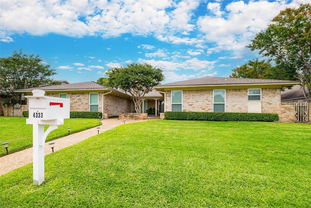 ranch-style house with a front yard