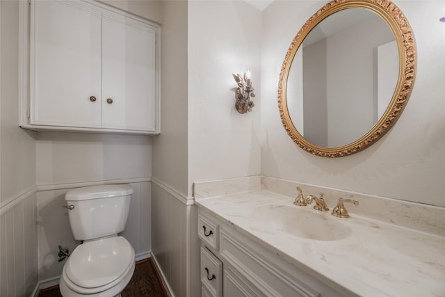 bathroom featuring vanity and toilet