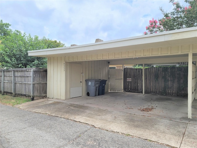 view of vehicle parking with a carport