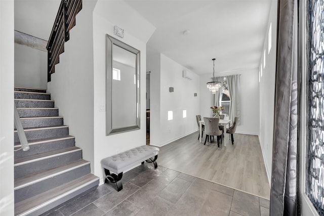 entryway with a notable chandelier