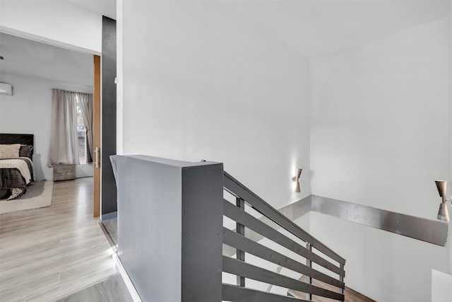 stairs featuring hardwood / wood-style floors