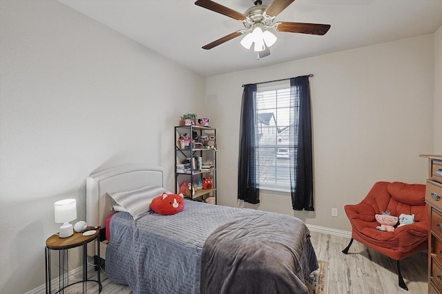 bedroom featuring ceiling fan and light wood-type flooring