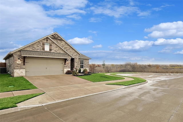 view of front of house featuring a front lawn and a garage