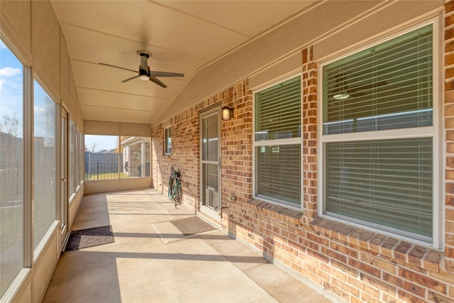 view of patio with ceiling fan and a porch