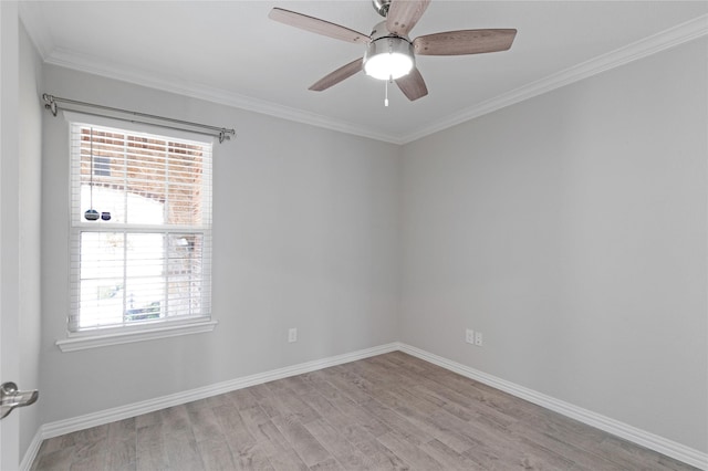 empty room featuring light hardwood / wood-style floors, ceiling fan, and crown molding