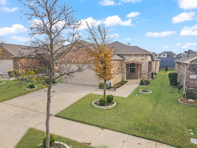 view of front of home featuring a garage and a front yard