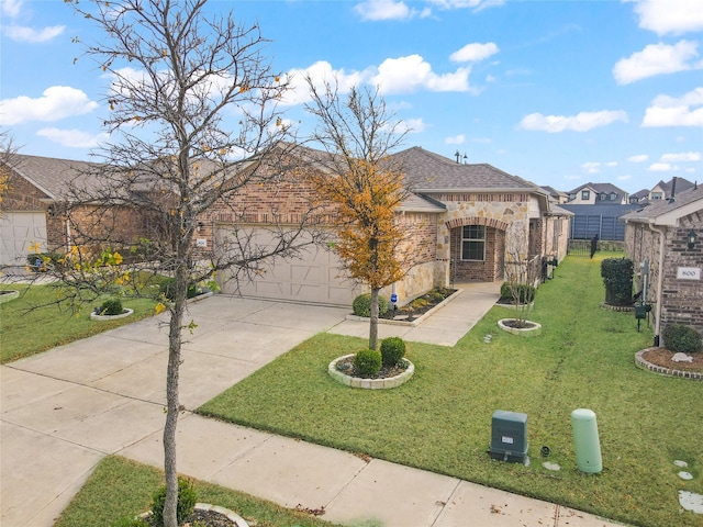 view of front of property with a front yard and a garage