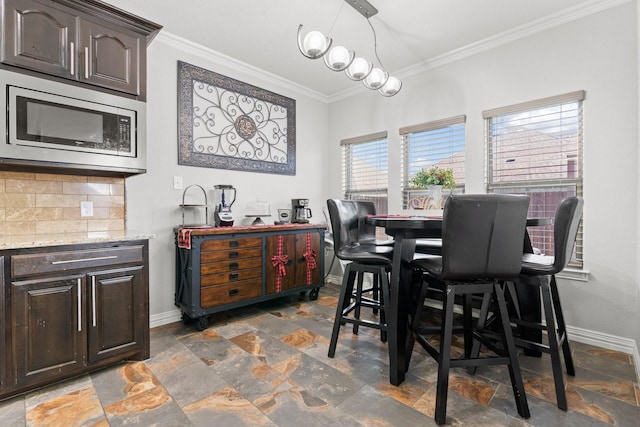 dining area featuring ornamental molding