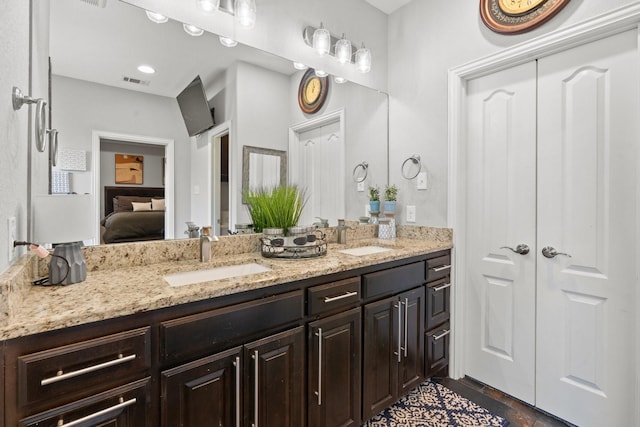 bathroom featuring vanity and hardwood / wood-style flooring