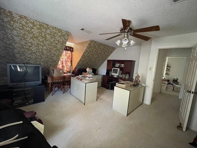 office area with ceiling fan and a textured ceiling