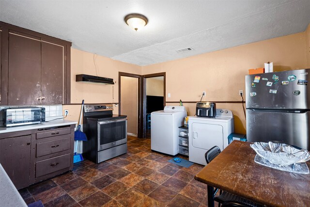 kitchen featuring backsplash, a textured ceiling, dark brown cabinetry, stainless steel appliances, and washing machine and clothes dryer