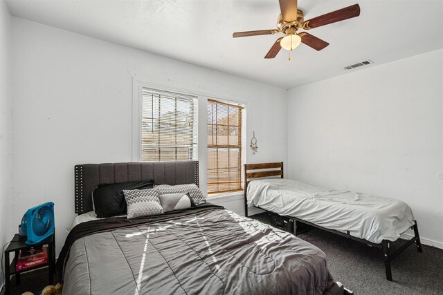 carpeted bedroom featuring ceiling fan