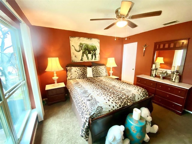 carpeted bedroom featuring ceiling fan