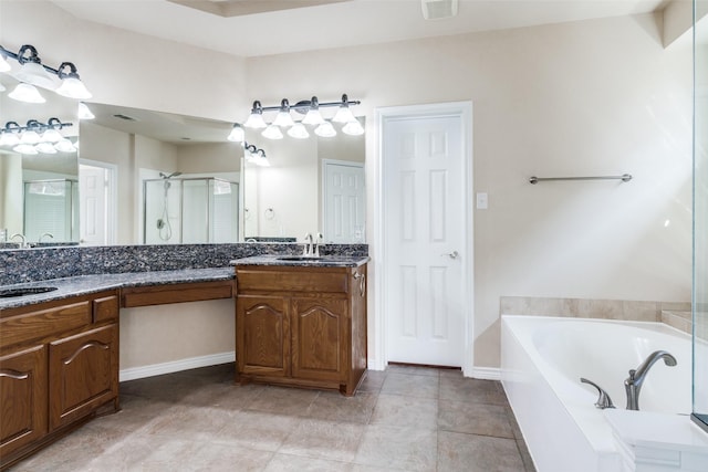 bathroom with vanity, plus walk in shower, and tile patterned flooring