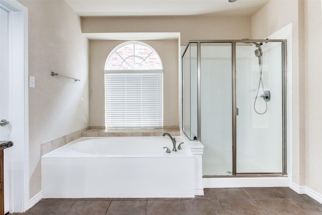 bathroom featuring tile patterned floors, vanity, and shower with separate bathtub