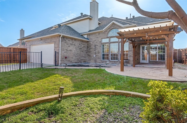 back of property with a garage, a pergola, a patio area, and a lawn