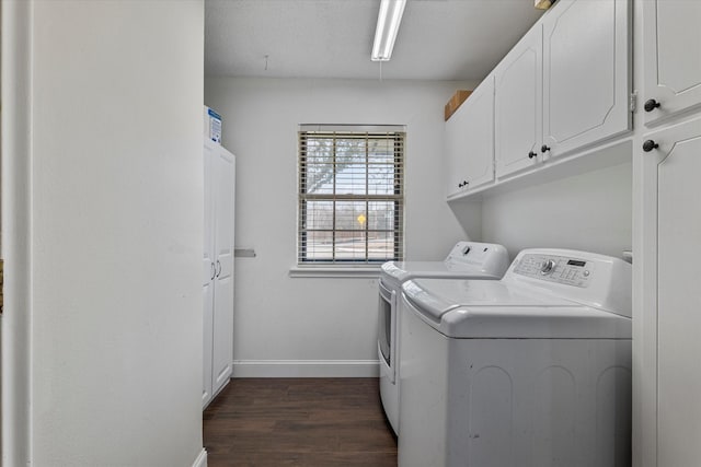 washroom featuring cabinets, dark wood-type flooring, and independent washer and dryer