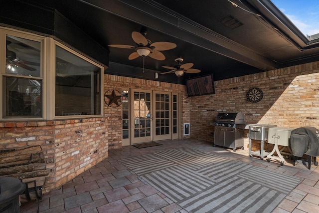 view of patio with an outdoor kitchen, grilling area, and ceiling fan