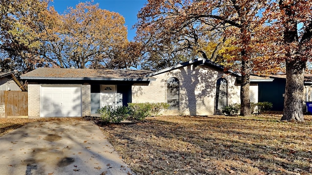 ranch-style house featuring a garage