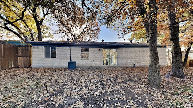 rear view of house with cooling unit