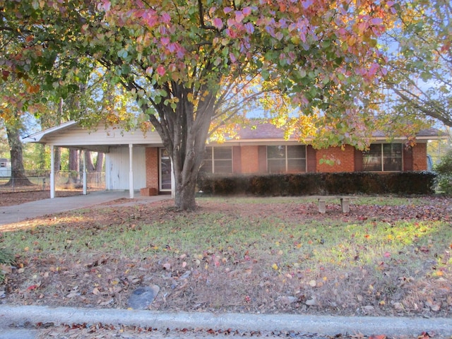 single story home with a carport