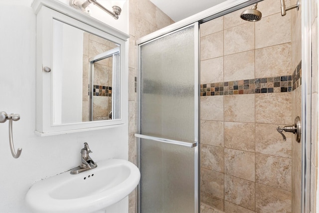 bathroom with sink and walk in shower