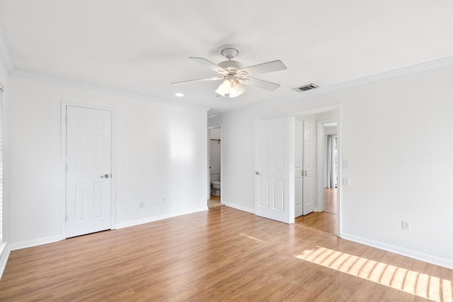 unfurnished bedroom featuring ceiling fan, light hardwood / wood-style flooring, and crown molding