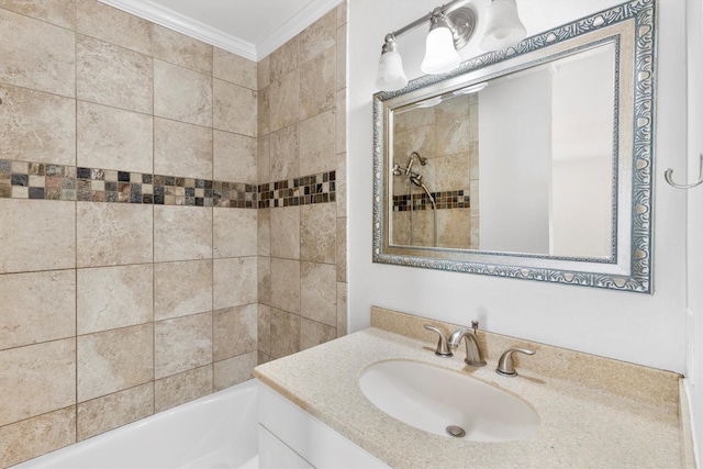 bathroom with vanity, tiled shower / bath combo, and ornamental molding