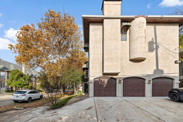 view of side of home featuring a garage