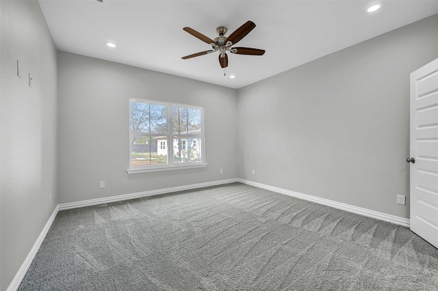 carpeted empty room featuring ceiling fan