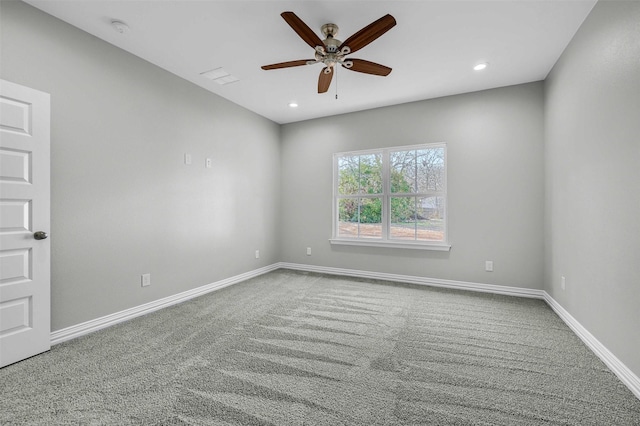 empty room featuring carpet floors and ceiling fan