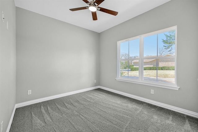 spare room featuring ceiling fan and carpet flooring