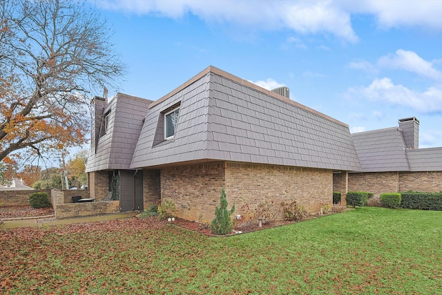 view of home's exterior featuring a yard