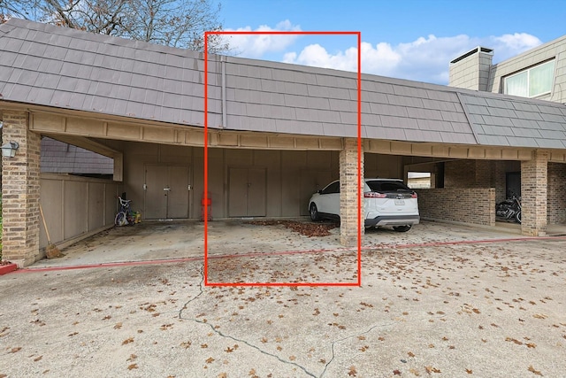 view of vehicle parking featuring a carport