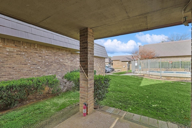 view of yard with a patio area and a community pool