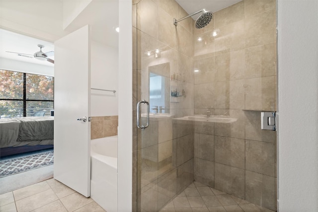 bathroom featuring tile patterned flooring, ceiling fan, and separate shower and tub