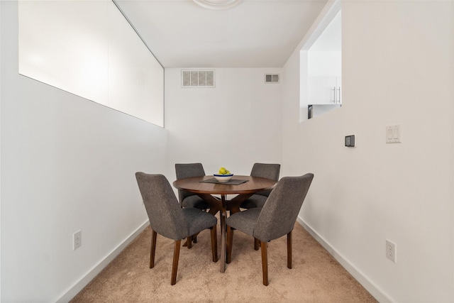 view of carpeted dining space