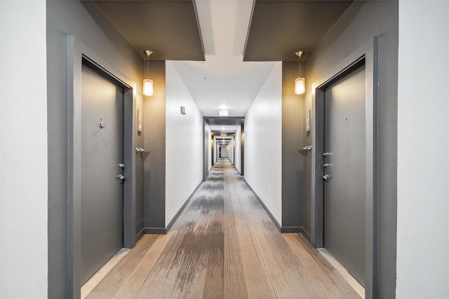 corridor featuring wood-type flooring