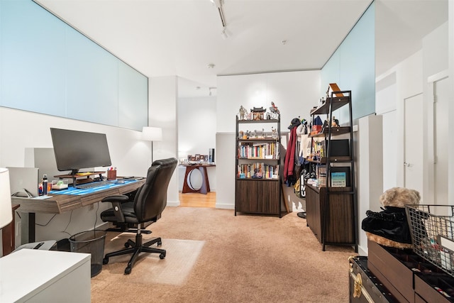 office space featuring light colored carpet and track lighting