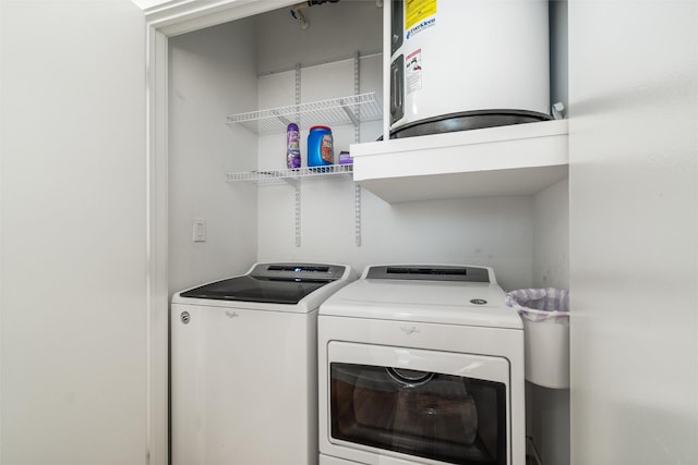 laundry area featuring washing machine and dryer and electric water heater