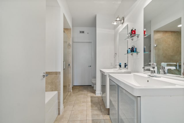 full bathroom with toilet, vanity, tile patterned floors, and plus walk in shower