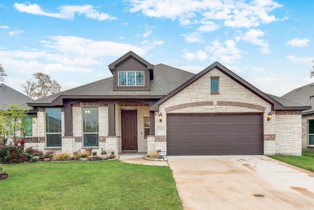 craftsman-style home featuring a garage and a front yard