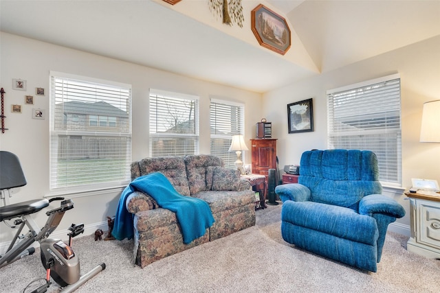 living room featuring vaulted ceiling and light colored carpet