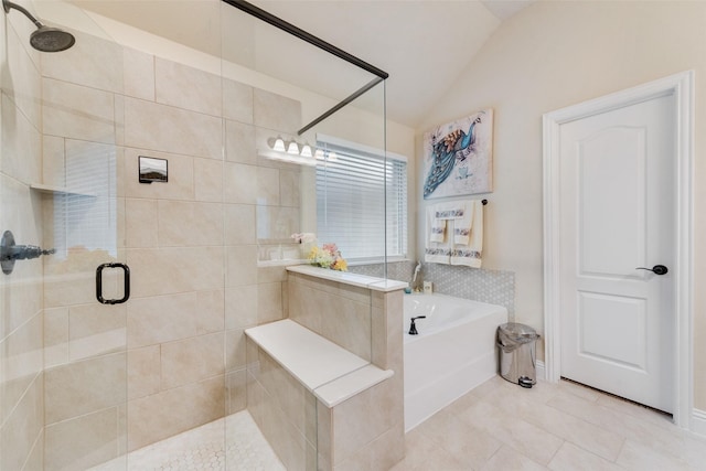 bathroom with independent shower and bath, vaulted ceiling, and tile patterned flooring